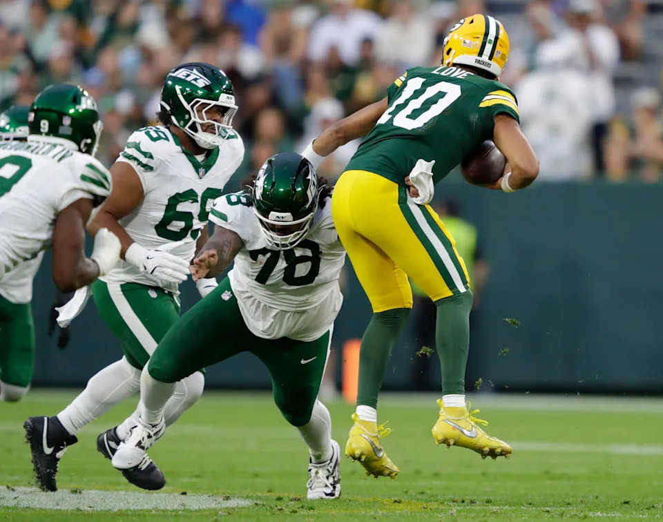 New York Jets defensive tackle Jay Tufele (78) sacks Green Bay Packers quarterback Jordan Love (10) during their football game Saturday, August 9, 2025, at Lambeau Field in Green Bay, Wisconsin.