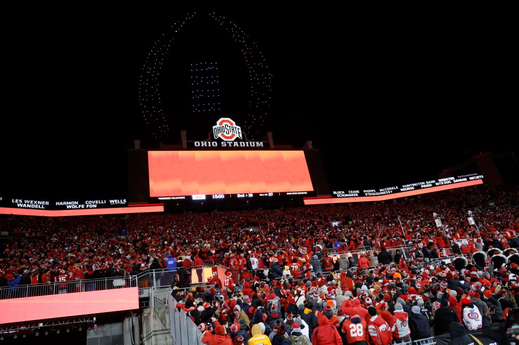 Drone show of the CFP logo over Ohio Stadium during a football game.