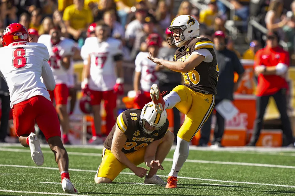 Sep 30, 2023; Laramie, Wyoming, USA; Wyoming Cowboys kicker John Hoyland (46) kicks a field goal against the New Mexico Lobos during the second quarter at Jonah Field at War Memorial Stadium. Mandatory Credit: Troy Babbitt-USA TODAY Sports
