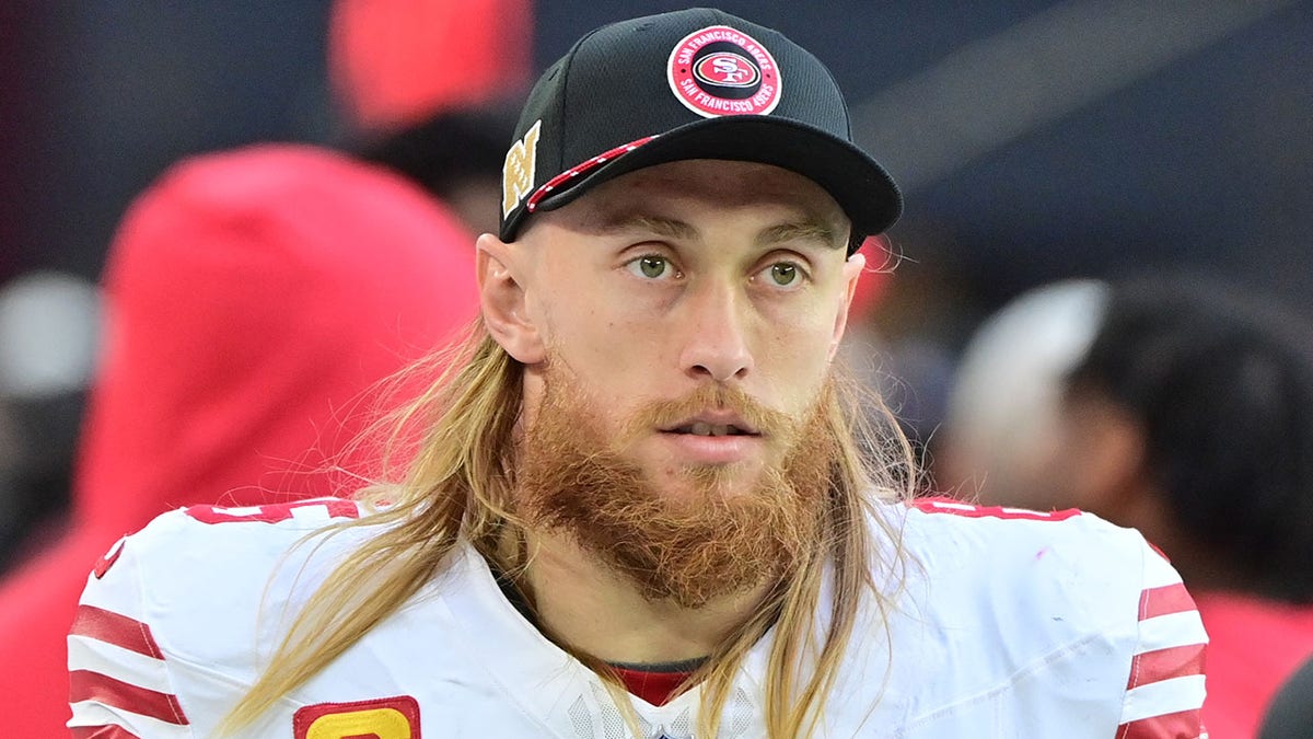 George Kittle looks on