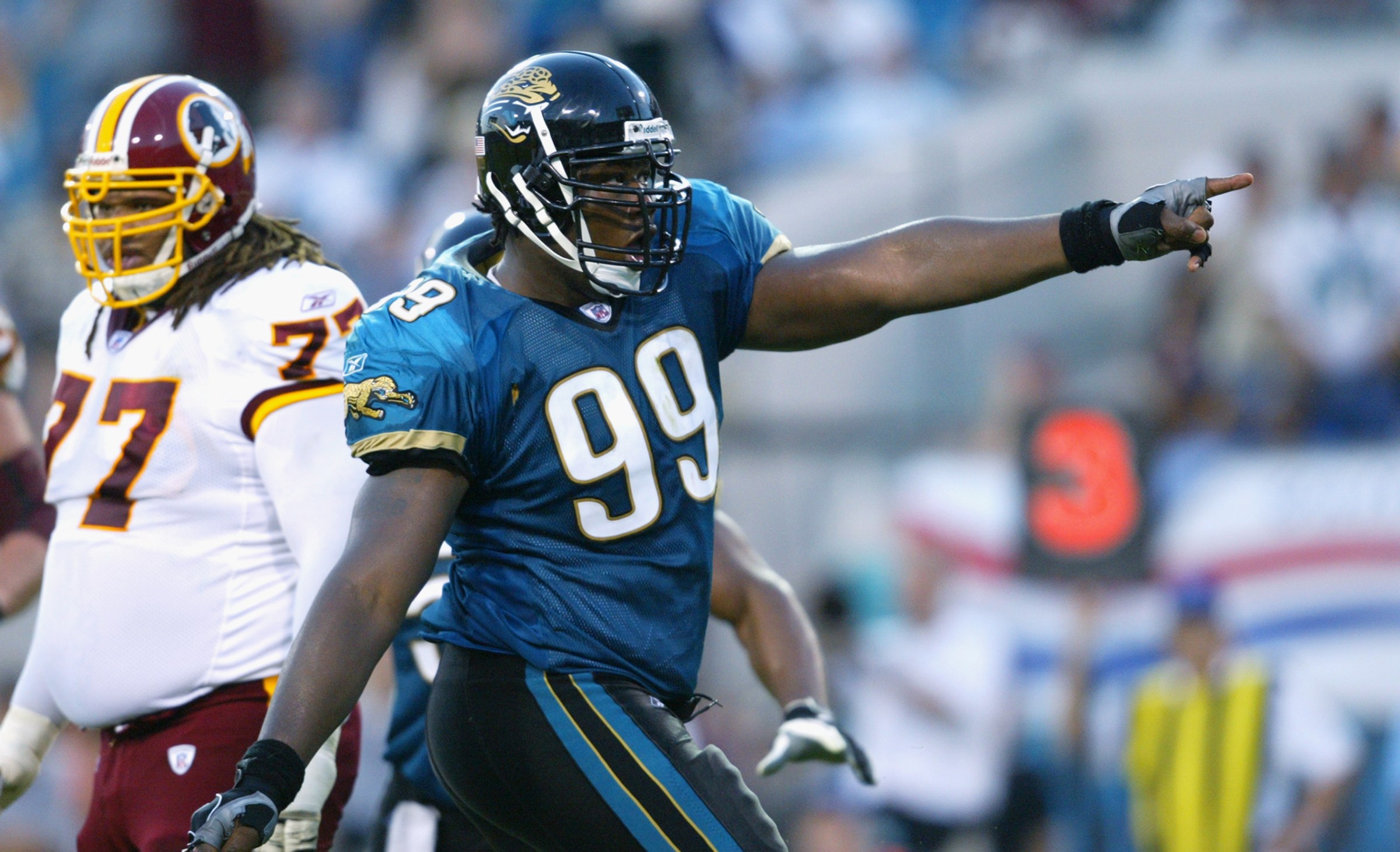 JACKSONVILLE, FL - NOVEMBER 10: Tackle Marcus Stroud #99 of the Jacksonville Jaguars celebrates during a game against the Washington Redskins on November 10, 2002 at Alltel Stadium in Jacksonville, Florida. The Jaguars beat the Redskins 26-7. (Photo by Jamie Squire/Getty Images)