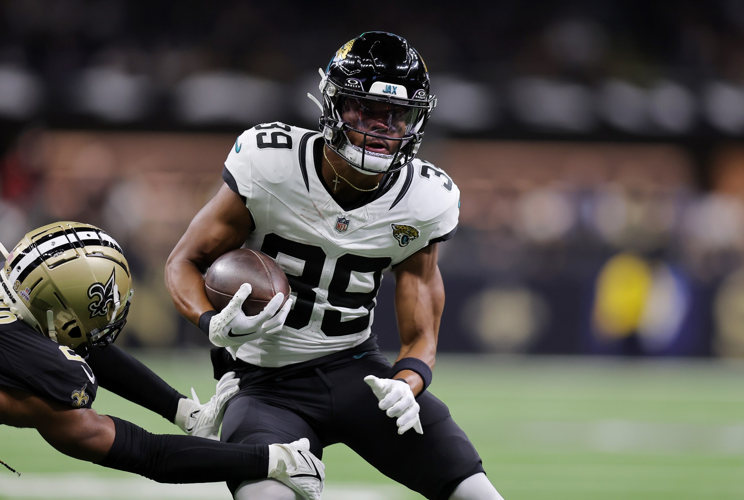NEW ORLEANS, LOUISIANA - OCTOBER 19: Jamal Agnew #39 of the Jacksonville Jaguars carries the ball during the first half against the New Orleans Saints at Caesars Superdome on October 19, 2023 in New Orleans, Louisiana. (Photo by Jonathan Bachman/Getty Images)