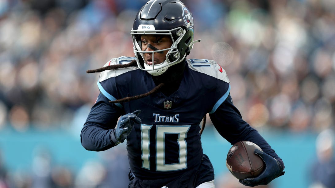 NASHVILLE, TENNESSEE - JANUARY 07: DeAndre Hopkins #10 of the Tennessee Titans runs with the ball during the first half against the Jacksonville Jaguars at Nissan Stadium on January 07, 2024 in Nashville, Tennessee.
