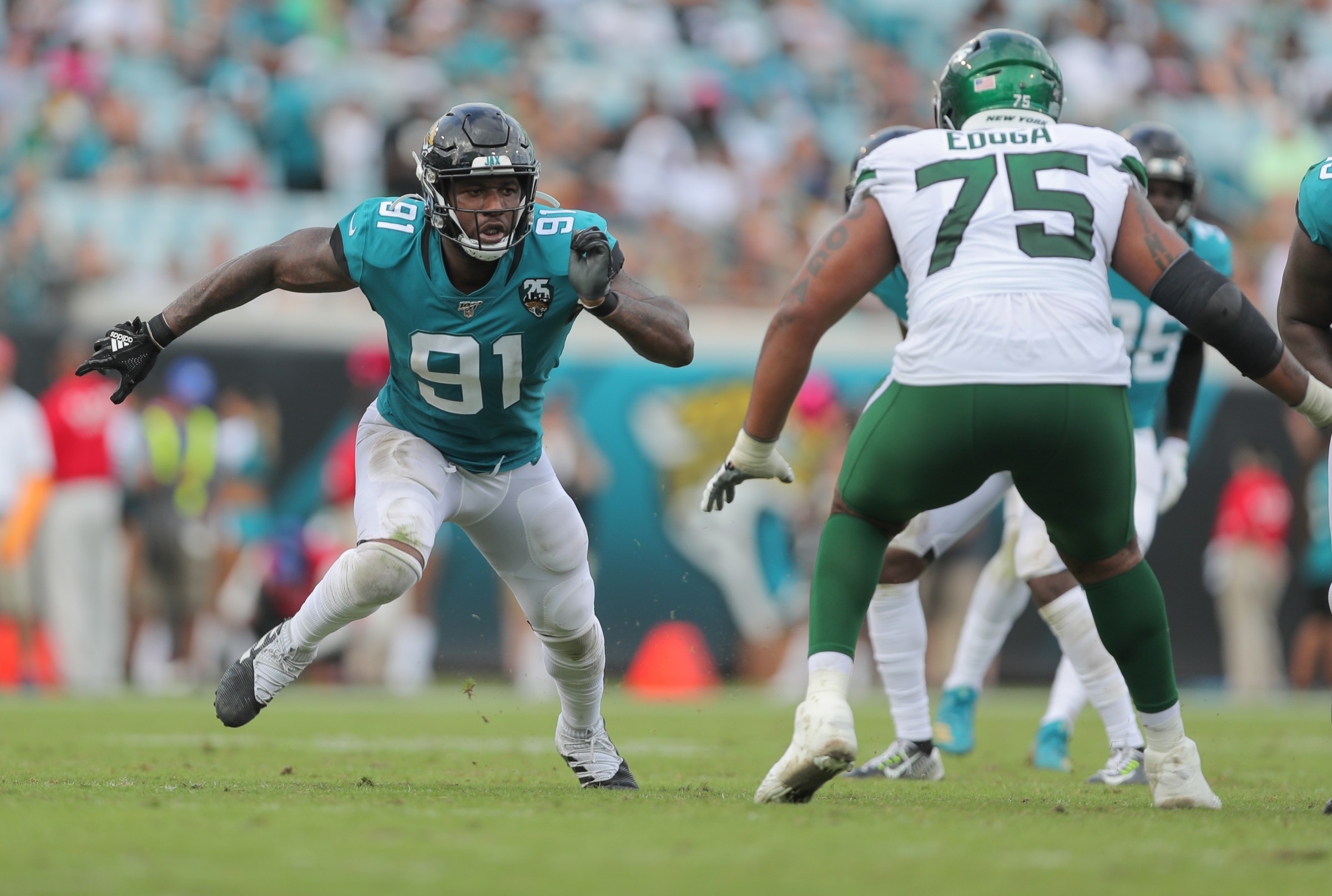 JACKSONVILLE, FL - OCTOBER 27: Yannick Ngakoue #91 of the Jacksonville Jaguars makes a move off the line of scrimmage during the second half of an NFL football game against the New York Jets at TIAA Bank Field on October 27, 2019 in Jacksonville, Florida. (Photo by Perry Knotts/Getty Images)