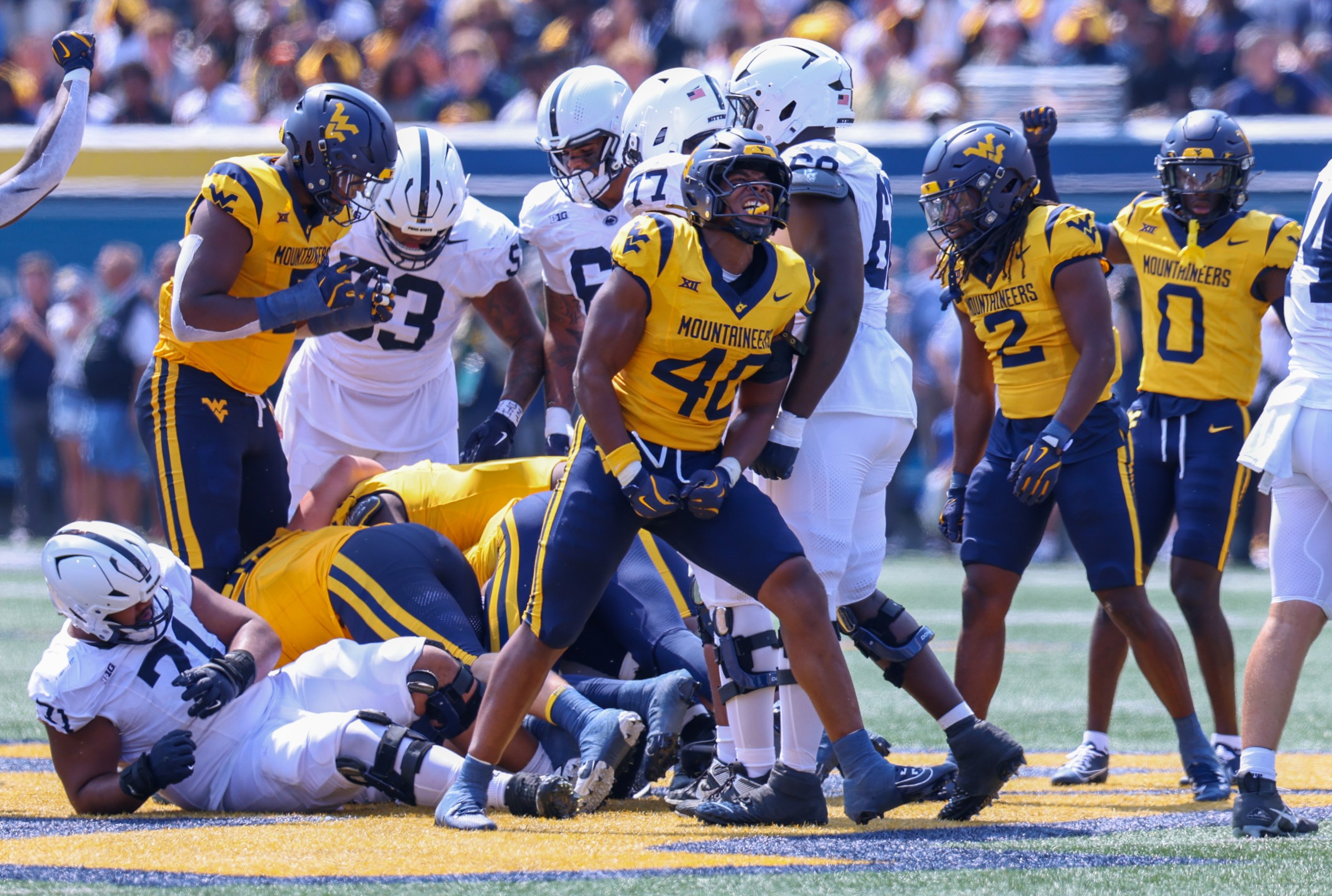 MORGANTOWN, WV - AUGUST 31: West Virginia Mountaineers linebacker Josiah Trotter #40 celebrates making a tackle during a game between Penn State and West Virginia at Milan Puskar Stadium on August 31, 2024 in Morgantown, West Virginia. (Photo by Roger Wimmer/ISI Photos/Getty Images)