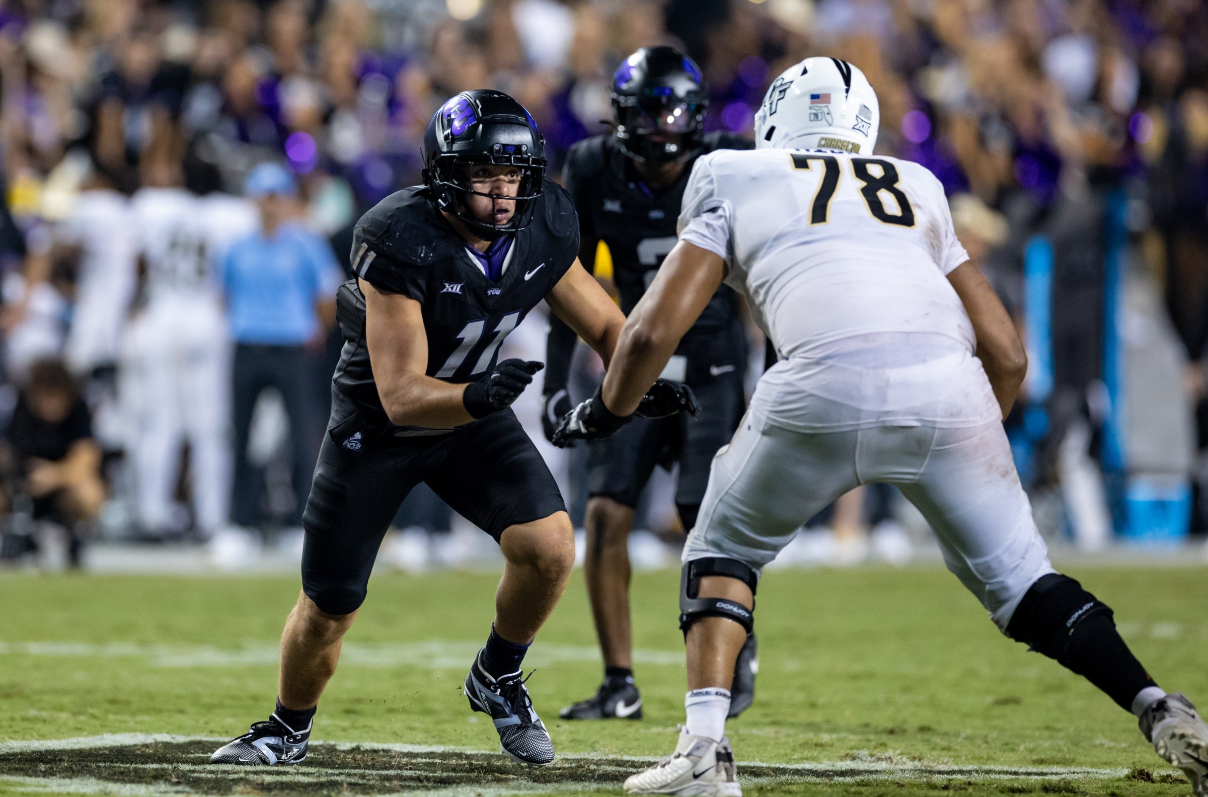 FORT WORTH, TX - SEPTEMBER 14: TCU Horned Frogs linebacker Devean Deal (#11) runs up field during the Big 12 college football game between the UCF Knights and TCU Horned Frogs on September 14, 2024 at Amon G. Carter Stadium in Fort Worth, TX. (Photo by Matthew Visinsky/Icon Sportswire via Getty Images)