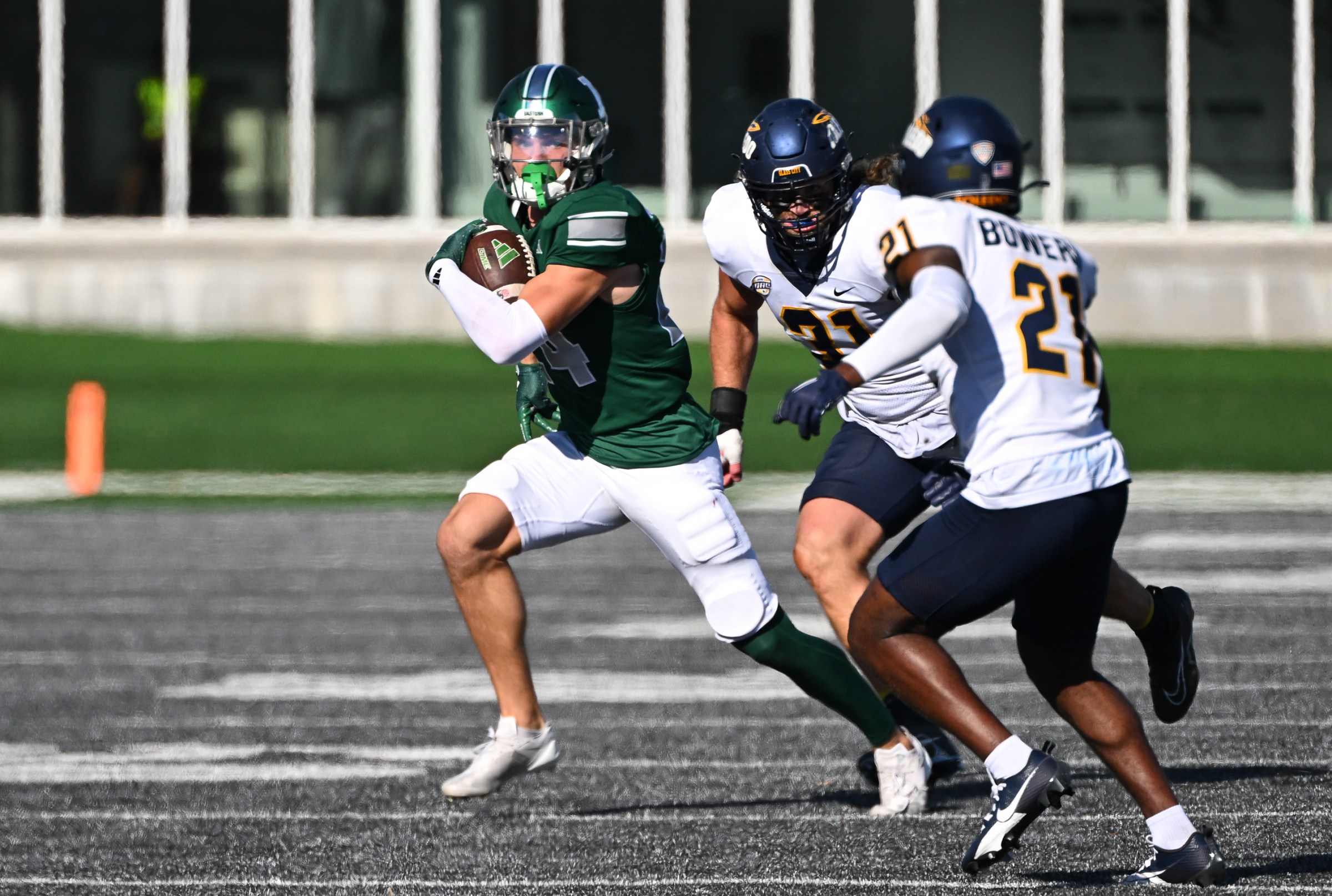 YPSILANTI, MI - NOVEMBER 02: Eastern Michigan Eagles running back Joey Mattord (24) runs wide for a first down with Toledo Rockets defensive back Nasir Bowers (21) chasing during the Eastern Michigan Eagles versus the Toledo Rockets game on Saturday November 2, 2024 at Rynearson Stadium on Crosby Field in Ypsilanti, MI. (Photo by Steven King/Icon Sportswire via Getty Images)