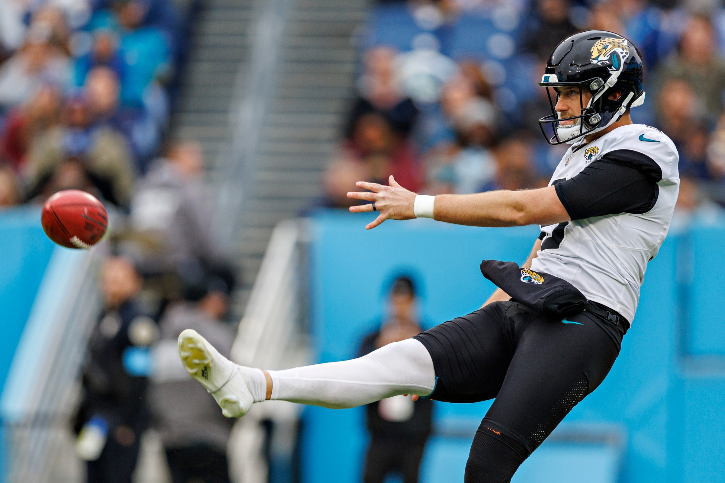 NASHVILLE, TENNESSEE - DECEMBER 8: Logan Cooke #9 of the Jacksonville Jaguars punts the ball during a game against the Tennessee Titans at Nissan Stadium on December 8, 2024 in Nashville, Tennessee. The Jaguars defeated the Titans 10-6. (Photo by Wesley Hitt/Getty Images)