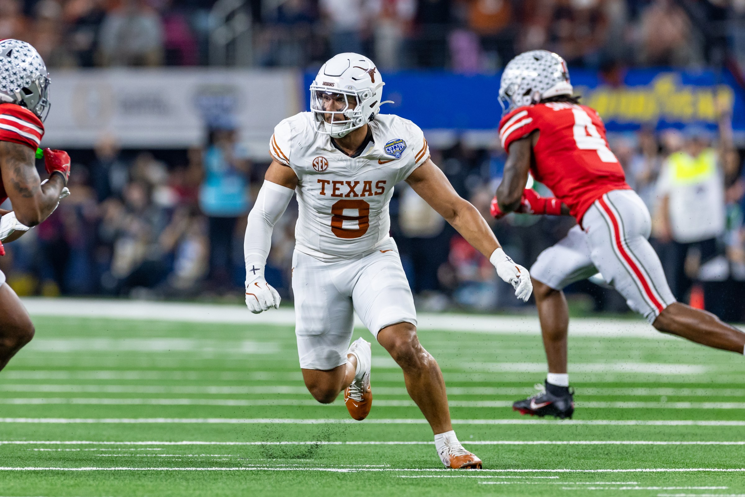ARLINGTON, TX - JANUARY 10: Texas Longhorns defensive end Trey Moore (#8) runs up field during the CFP Semifinal Cotton Bowl Classic football game between the Ohio State Buckeyes and Texas Longhorns on January 10, 2025 at AT&T Stadium in Arlington, TX. (Photo by Matthew Visinsky/Icon Sportswire via Getty Images)