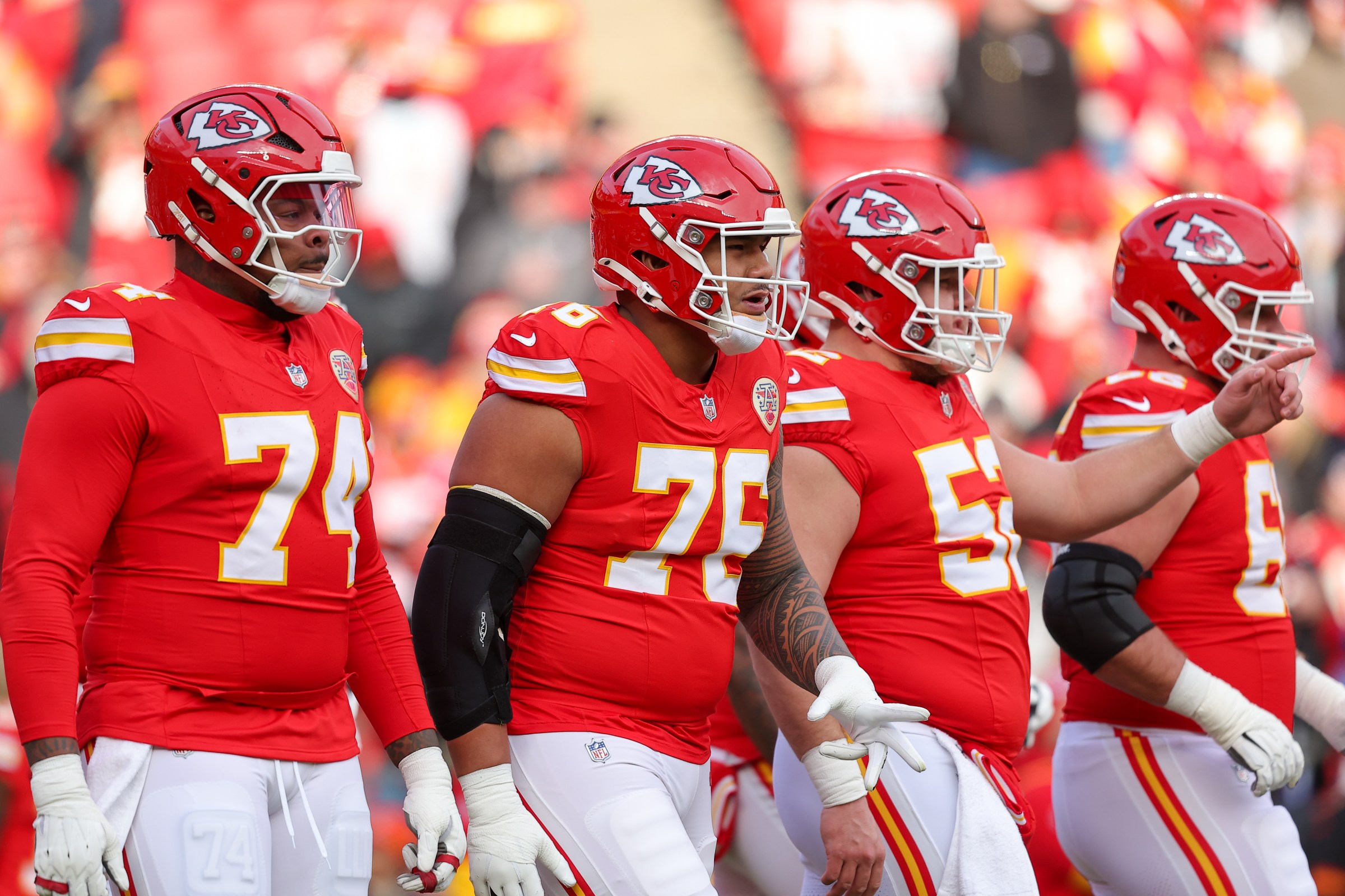 KANSAS CITY, MISSOURI - JANUARY 18: Kingsley Suamataia #76 of the Kansas City Chiefs breaks the offensive huddle during pregame warmups prior to the Divisional Round playoff game against the Houston Texans at GEHA Field at Arrowhead Stadium on January 18, 2025 in Kansas City, Missouri. (Photo by David Eulitt/Getty Images)