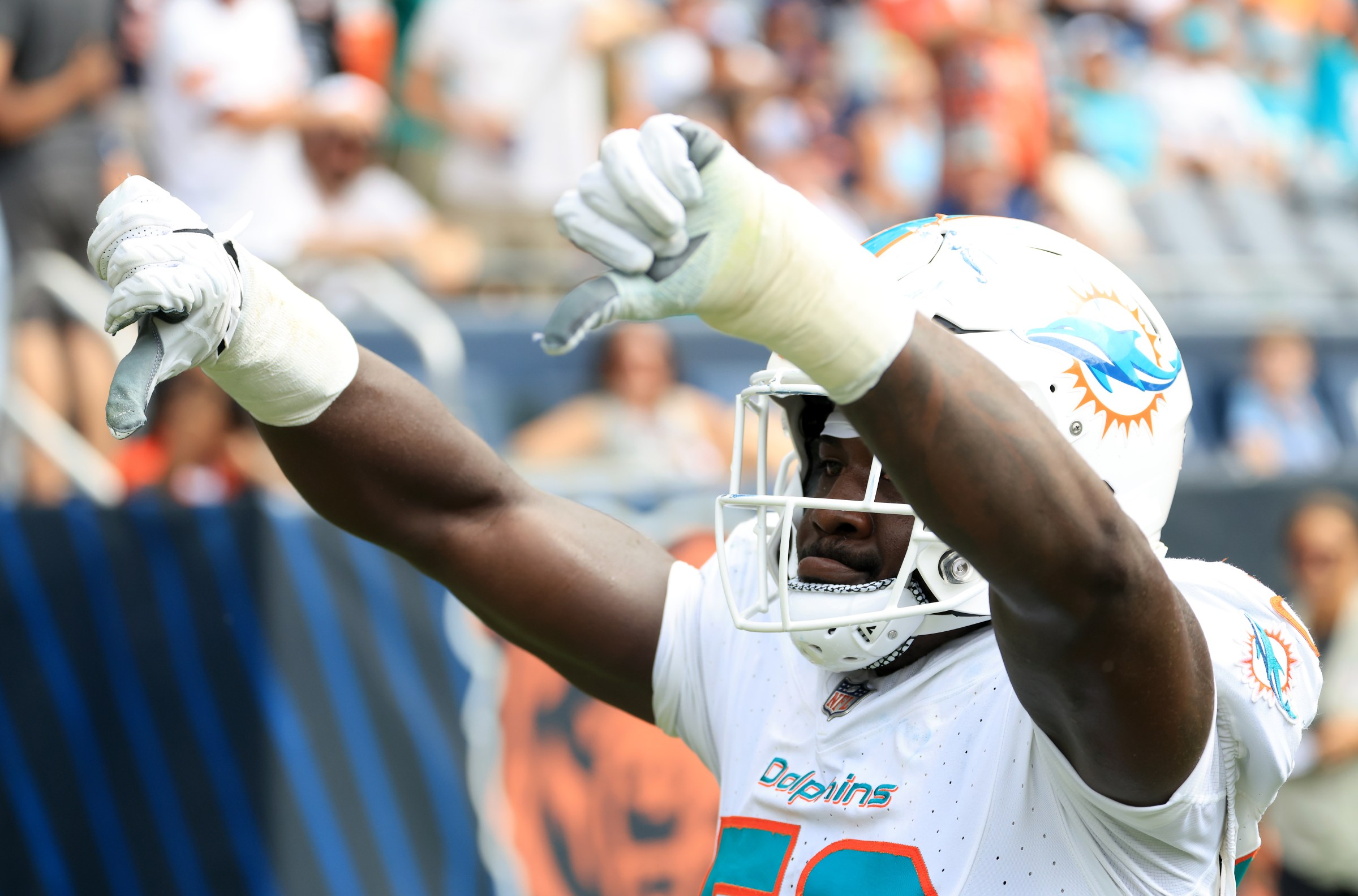 CHICAGO, ILLINOIS - AUGUST 10: Derrick McLendon #59 of the Miami Dolphins reacts after a play during the fourth quarter of the NFL Preseason 2025 game against the Chicago Bears at Soldier Field on August 10, 2025 in Chicago, Illinois. (Photo by Justin Casterline/Getty Images)