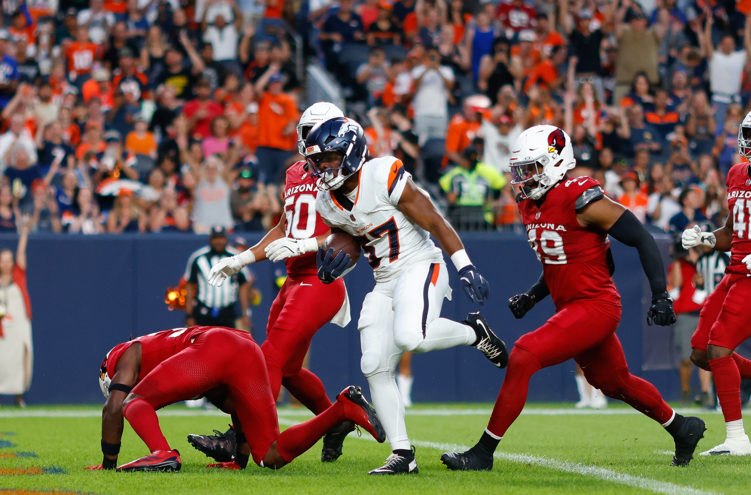 DENVER, CO - AUGUST 16: RJ Harvey #37 of the Denver Broncos runs in for a touchdown during the first quarter against the Arizona Cardinals during the NFL Preseason 2025 game at Empower Field at Mile High on August 16, 2025 in Denver, Colorado. (Photo by Justin Edmonds/Getty Images)