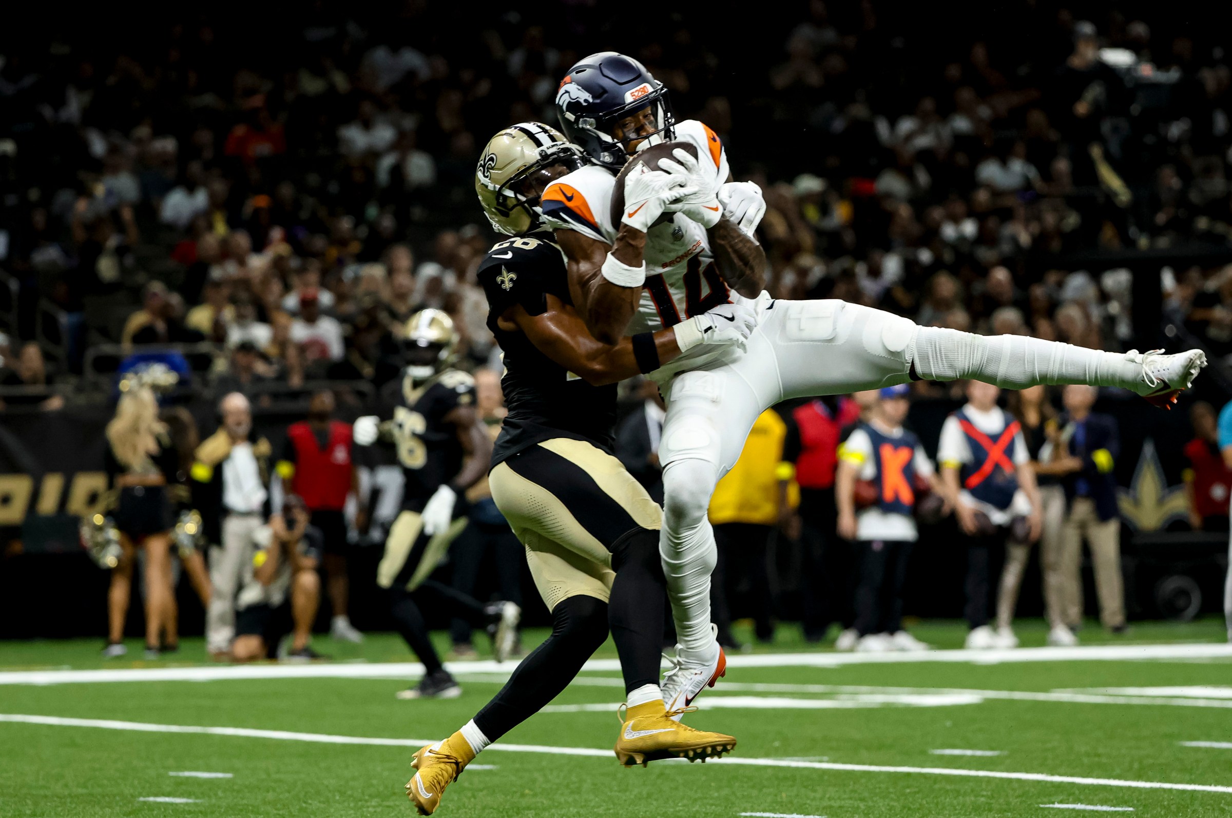 NEW ORLEANS, LOUISIANA - AUGUST 23: Courtland Sutton #14 of the Denver Broncos catches a touchdown over Julian Blackmon #28 of the New Orleans Saints during the first half of a preseason game at the Caesars Superdome on August 23, 2025 in New Orleans, Louisiana. (Photo by Derick E. Hingle/Getty Images)