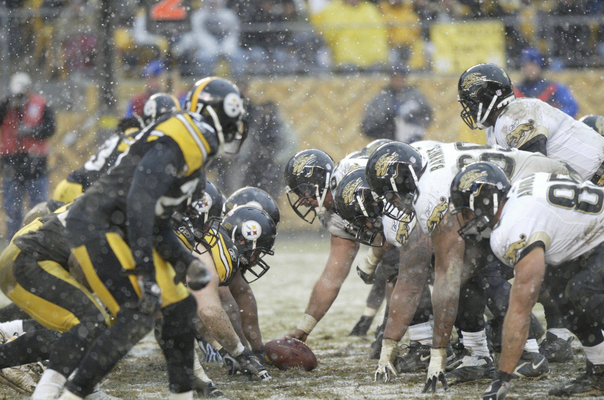 PITTSBURGH - DECEMBER 16: Center Brad Meester #63 (with ball), quarterback David Garrard #9 and the offensive line of the Jacksonville Jaguars face the defensive unit of the Pittsburgh Steelers (left) as snow falls during a game at Heinz Field on December 16, 2007 in Pittsburgh, Pennsylvania. The Jaguars defeated the Steelers 29-22. (Photo by George Gojkovich/Getty Images)