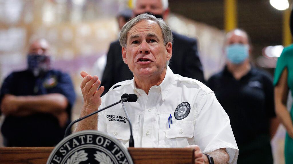 Texas Gov. Greg Abbott speaks to the media during a visit to a Texas Division of Emergency Management Warehouse filled with Personal Protective Equipment, Tuesday, Aug. 4, 2020, in San Antonio. (AP Photo/Eric Gay)