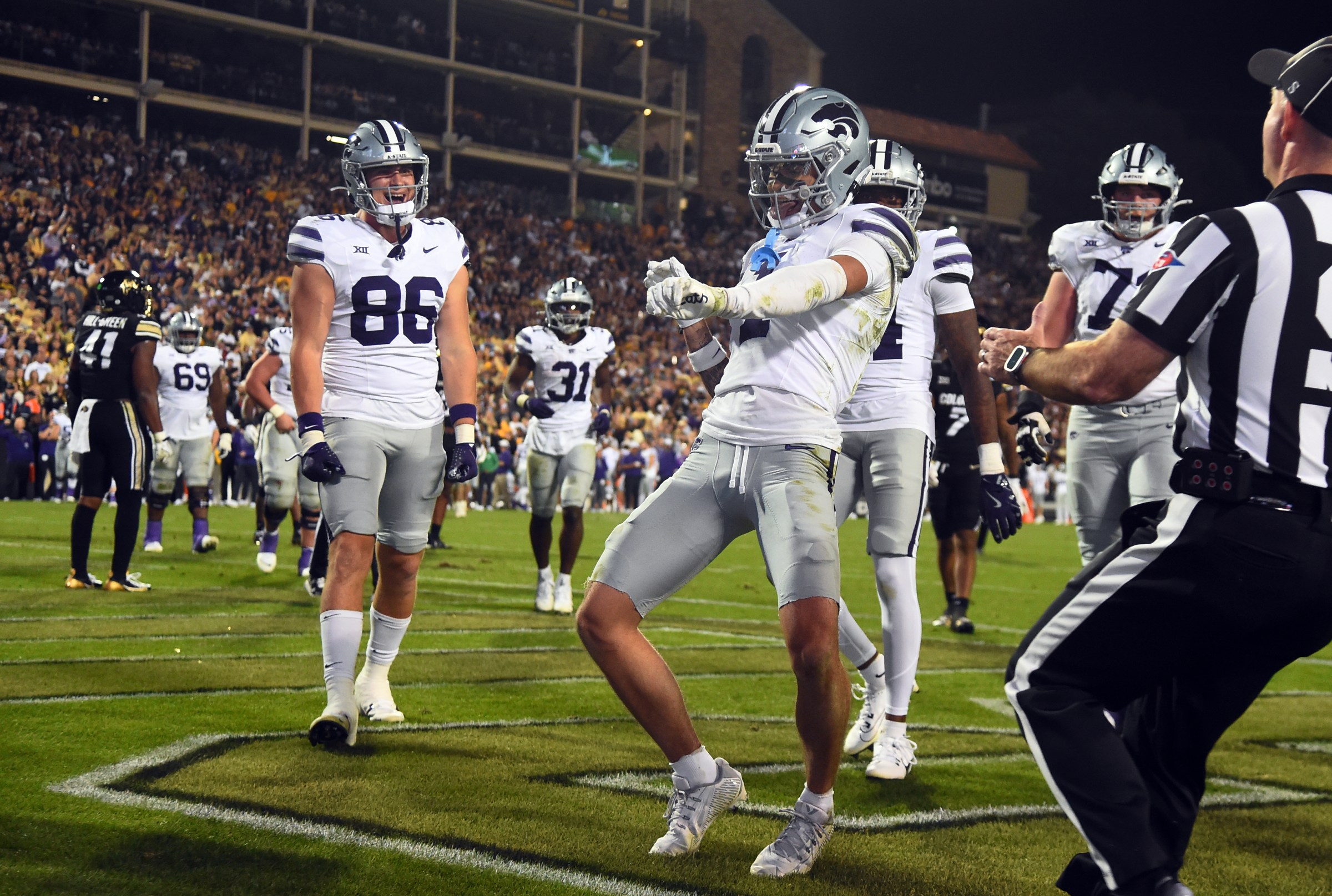 Oct 12, 2024; Boulder, Colorado, USA; Kansas State Wildcats wide receiver Jayce Brown (1) celebrates after a touchdown during the second half against the Colorado Buffaloes at Folsom Field. Mandatory Credit: Christopher Hanewinckel-Imagn Images
