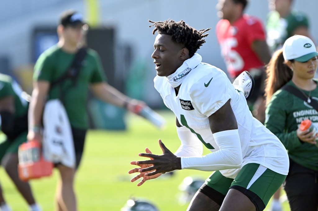 Sauce Gardner, Jets cornerback, stretching at training camp.