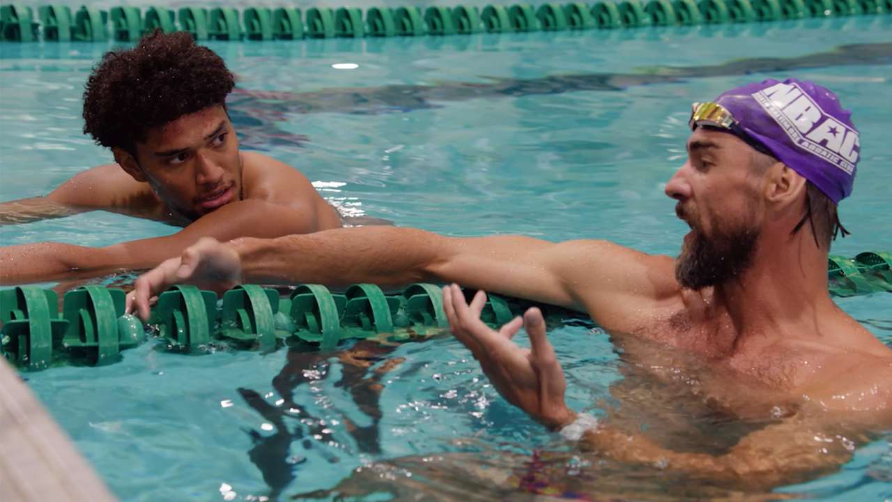 Michael Phelps Teaches Ravens to Swim, Visits Practice