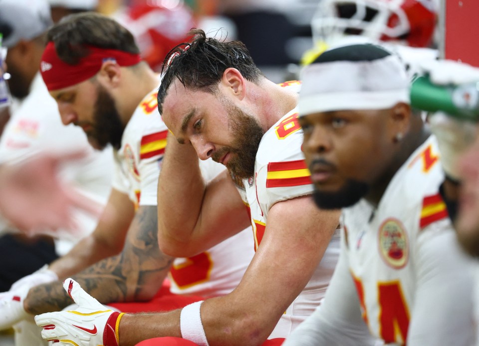 Travis Kelce, Kansas City Chiefs tight end, looking dejected on the sidelines.
