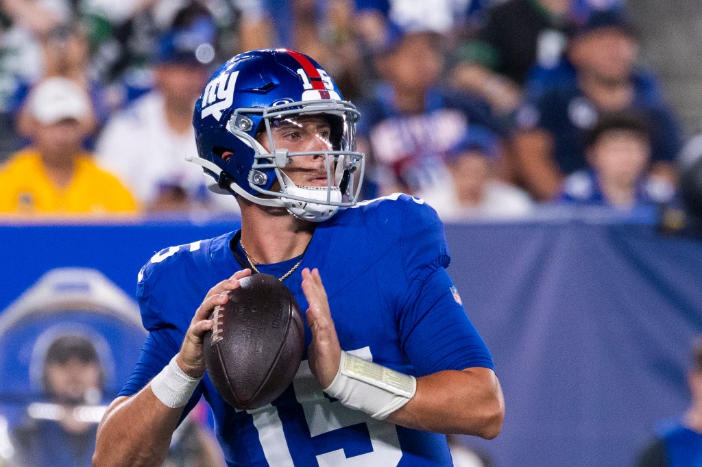New York Giants quarterback Tommy DeVito prepares to throw the football.