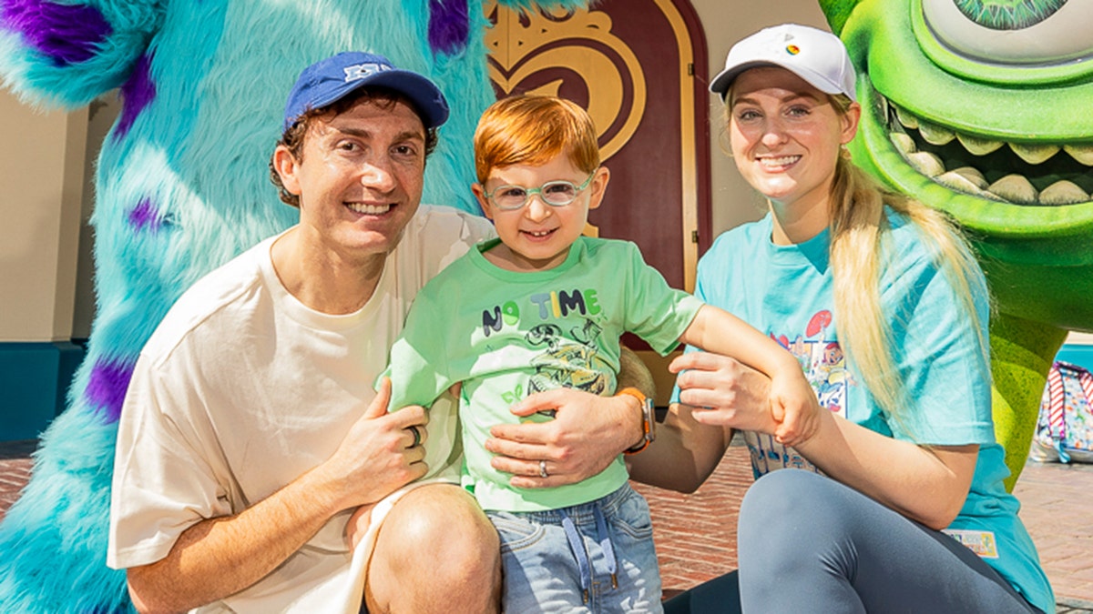 Meghan Trainor and Daryl Sabara with their son Riley at Disney California Adventure Park.