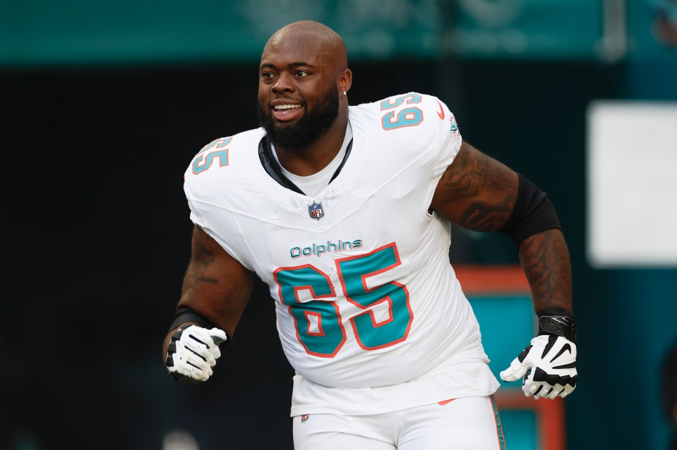 Miami Dolphins guard Robert Jones (#65) on the field.