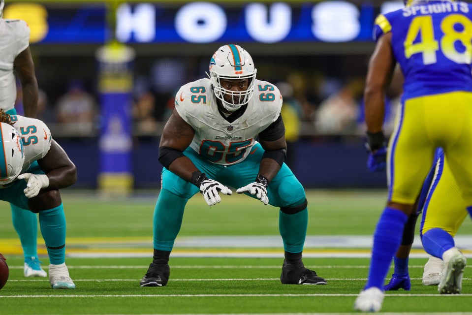 Miami Dolphins guard Robert Jones (#65) on the field.
