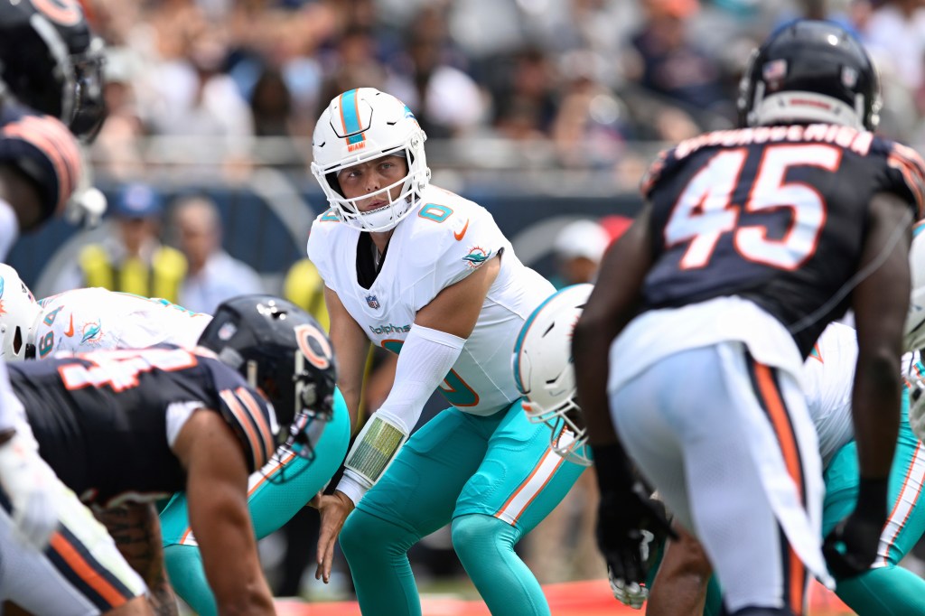 Zach Wilson, Miami Dolphins quarterback, at the line of scrimmage.