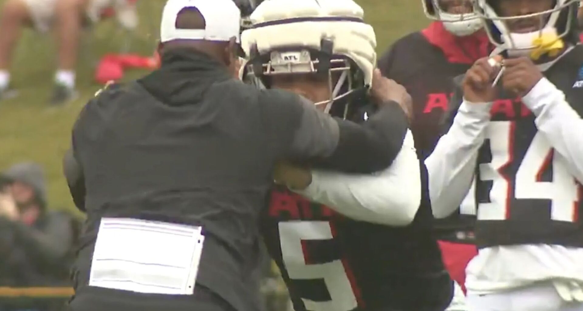 Stunning moment as NFL head coach pushed to ground by his own star player during training camp