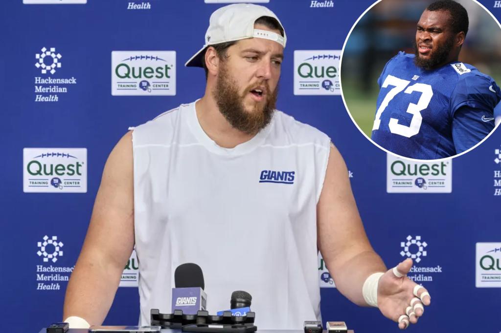 Greg Van Roten imparting wisdom on Evan Neal in awkward Giants position battle