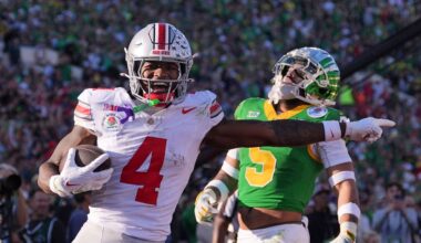 Ohio State wide receiver Jeremiah Smith (4) scores a touchdown against Oregon defensive back Kobe Savage (5) during the first half in the quarterfinals of the Rose Bowl College Football Playoff, Wednesday, Jan. 1, 2025, in Pasadena, Calif. (AP Photo/Mark J. Terrill, File)