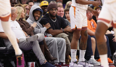 Paris Johnson Jr. and Kyler Murray look on during a Suns game...