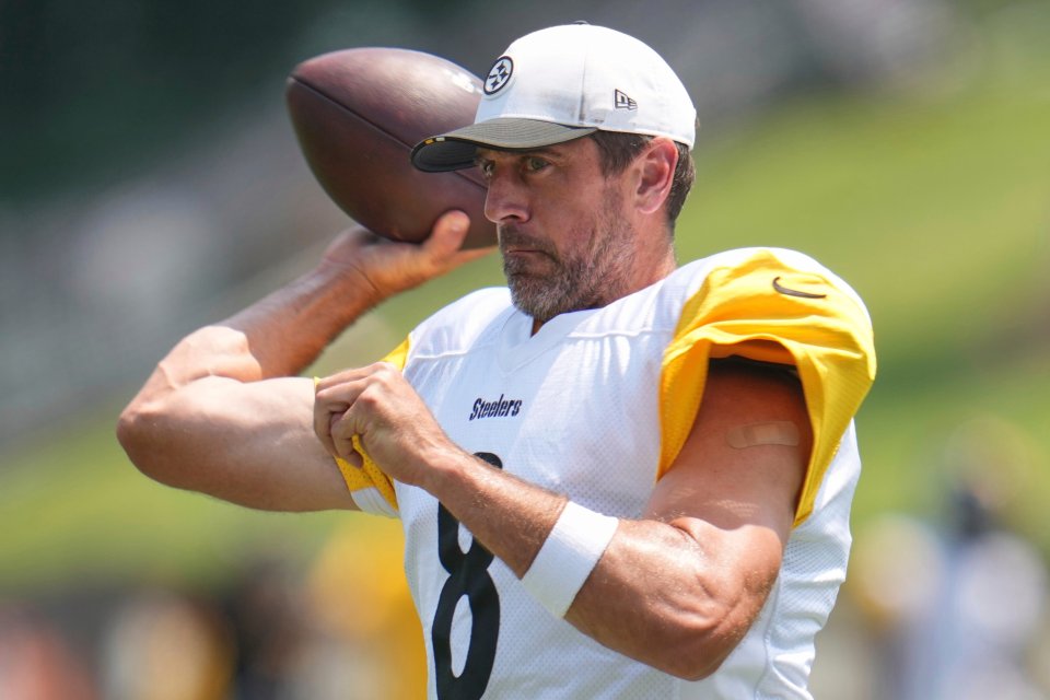 Aaron Rodgers, Pittsburgh Steelers quarterback, throwing a football during practice.