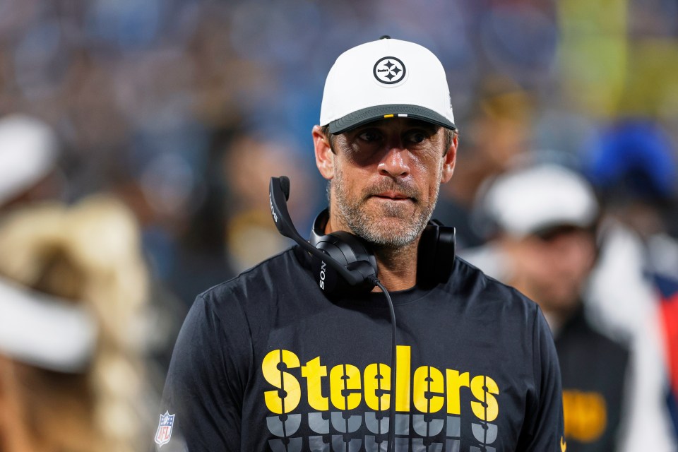 Aaron Rodgers, Pittsburgh Steelers quarterback, wearing a headset on the sidelines.