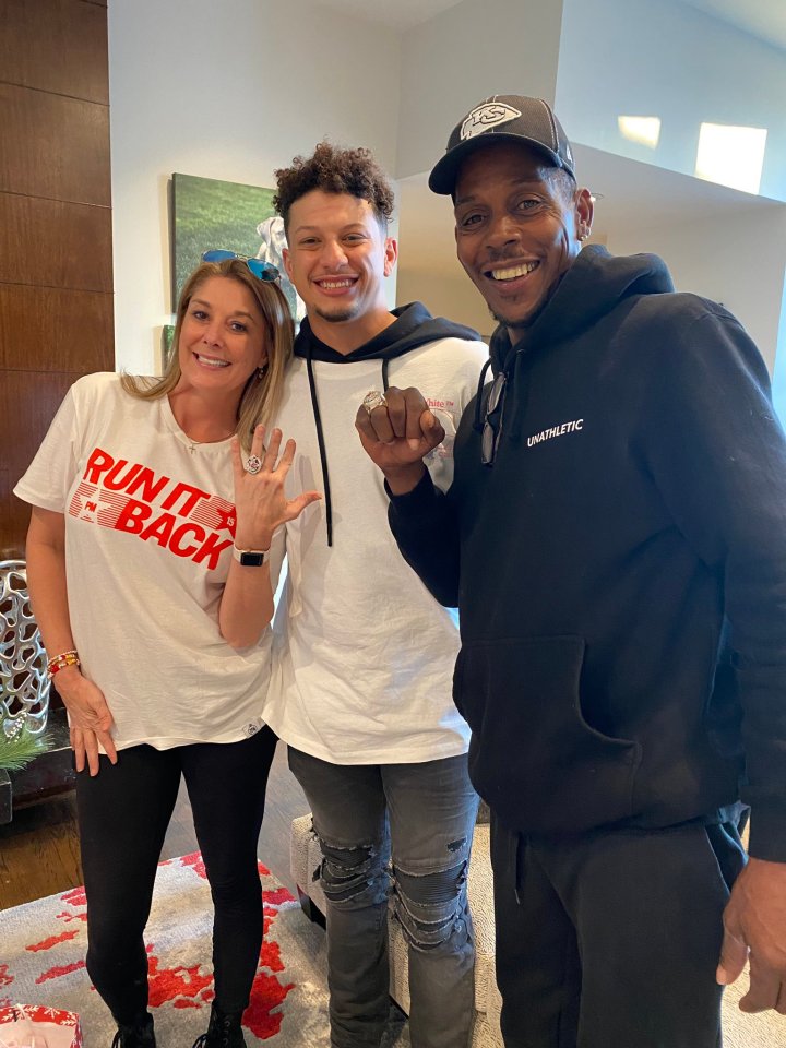 Patrick Mahomes, his mother, and father, all wearing Super Bowl rings.