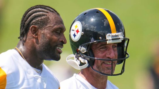 Steelers quarterback Aaron Rodgers and wide receiver DK Metcalf smile as they talk during training camp in Latrobe, PA.