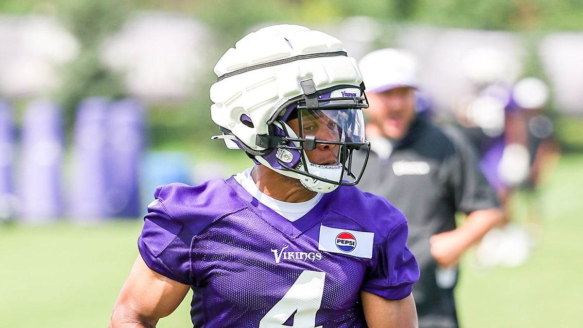 Rondale Moore looks on at practice