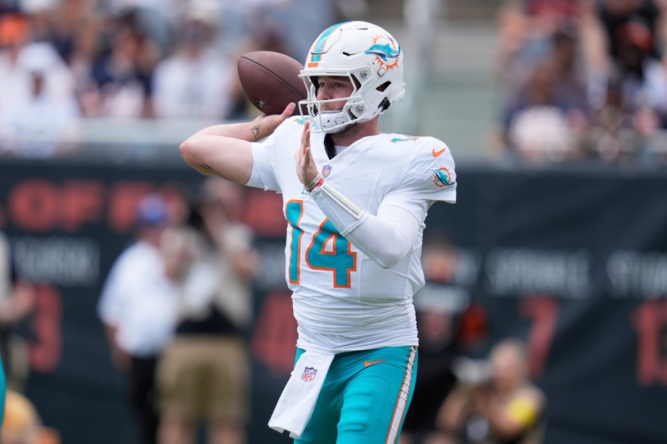 Miami Dolphins quarterback Quinn Ewers (14) prepares to pass the ball.