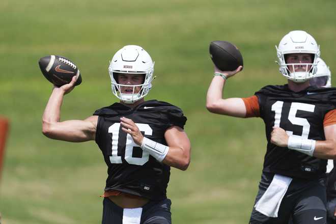 Texas football Texas quarterback Arch Manning (16) and quarterback Trey Owens (15) go through drills during an NCAA college football practice in Austin, Texas, Wednesday, July 30, 2025.