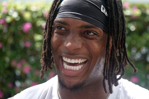 Miami Dolphins running back Ollie Gordon II speaks to the...