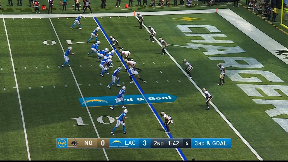 American football game, 3rd and goal.