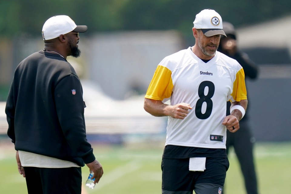 Aaron Rodgers and Mike Tomlin at Steelers minicamp.