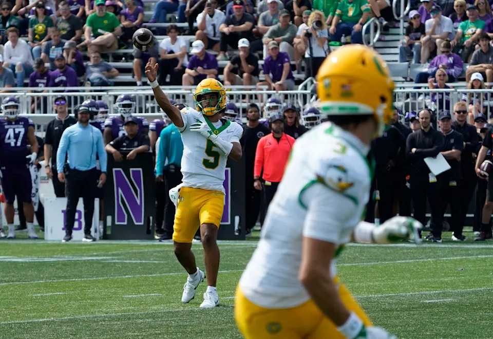 Sep 13, 2025; Evanston, Illinois, USA; Oregon Ducks quarterback Dante Moore (5) throws the ball against the Northwestern Wildcats during the second half at Northwestern Medicine Field at Martin Stadium. Mandatory Credit: David Banks-Imagn Images