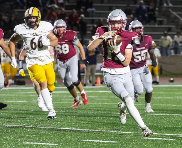 Fitchburg's John Hartwell-Cormier carries the ball during Friday's game against Greater Lowell Tech. (Sentinel & Enterprise / Gary Fournier)