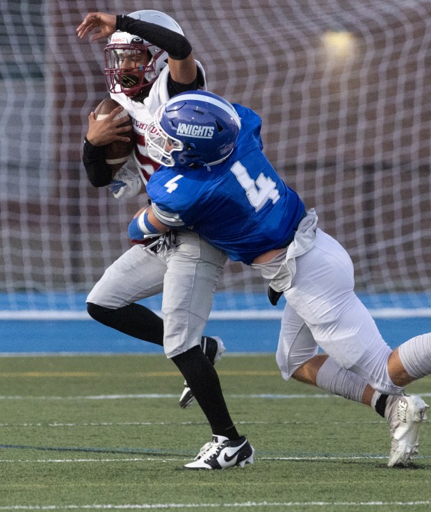 Fitchburg's Jerome Best II is tackled by Lunenburg's Rory Ferguson during Friday night's game. (Sentinel & Enterprise / Gary Fournier)