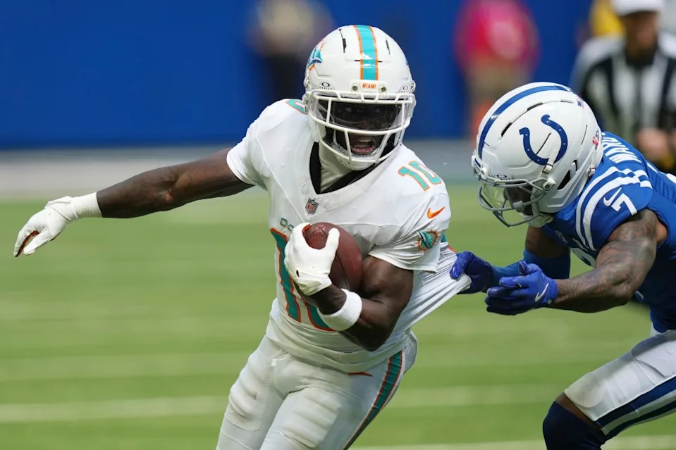 Miami Dolphins wide receiver Tyreek Hill (10) is tackled by Indianapolis Colts cornerback Charvarius Ward (7) during the second half of an NFL football game Sunday, Sept. 7, 2025, in Indianapolis. AP
