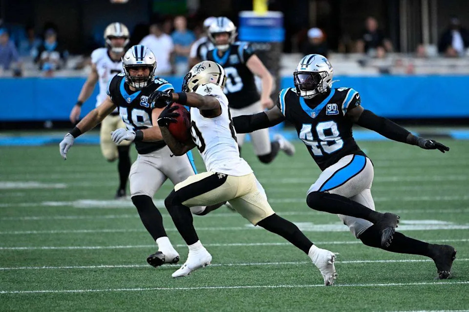 New Orleans Saints wide receiver Jermaine Jackson (80) holds the ball as Carolina Panthers linebackers Jon Rhattigan (49) and Thomas Incoom (48) defend in the fourth quarter at Bank of America Stadium on Nov 3, 2024.