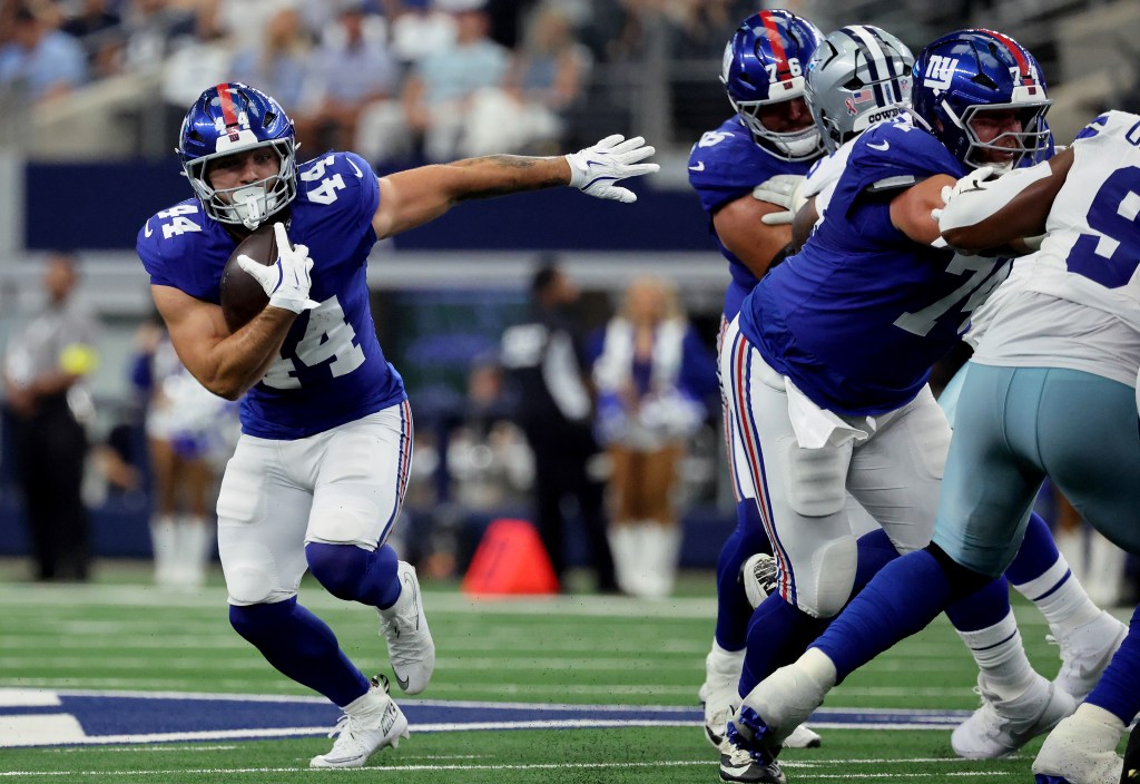 New York Giants' Cam Skattebo running withCam Skattebo runs with the ball during the Giants-Cowboys game on Sept. 14, 2025.  the football.