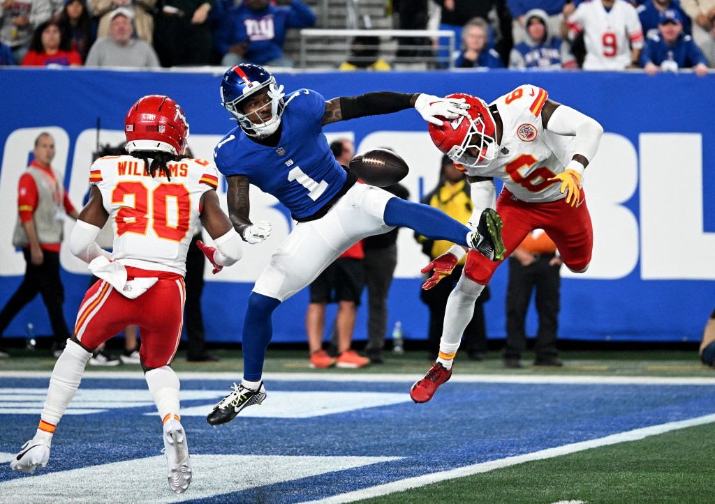 Wide receiver Malik Nabers #1 of the New York Giants fails to complete a reception and collides with safety Bryan Cook #6 of the Kansas City Chiefs and cornerback Nohl Williams #20 of the Kansas City Chiefs during the fourth quarter of the Giants and Kansas City Chiefs game in East Rutherford, N.J. 