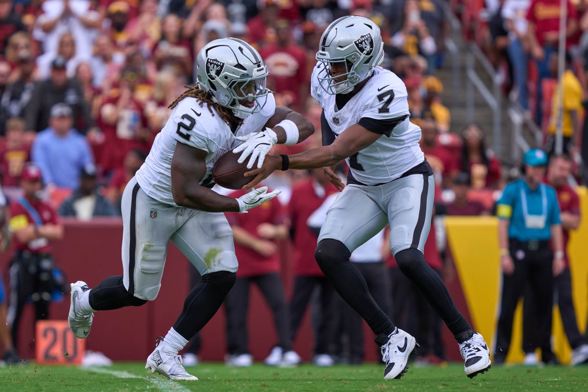 Geno Smith #7 hands the football to Ashton Jeanty #2 of the Las Vegas Raiders during the first half against the Washington Commanders during an NFL football game at Northwest Stadium on September 21, 2025 in Landover, Maryland. Photo by (M. Shafquat - The Sporting Tribune) Geno Smith #7 hands the football to Ashton Jeanty #2 of the Las Vegas Raiders during the first half against the Washington Commanders during an NFL football game at Northwest Stadium on September 21, 2025 in Landover, Maryland. Photo by (M. Shafquat - The Sporting Tribune)